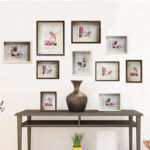 Cadre photo en bois classique et rétro. Bonne qualité et très original accrochée sur un mur au-dessus d'une table dans une maison