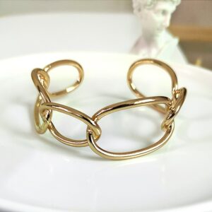 Bracelet manchette chaine dorée, à la mode. Très bonne qualité