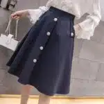 Jupe vintage mi-longue couleur unie à simple boutonnage, bonne qualité et à la mode