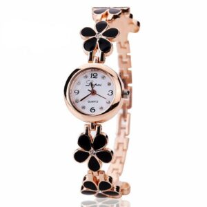 Montre vintage doré à motif fleur noir pour femme. Bonne qualité et très tendance.
