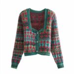 Cardigan vintage en tricot avec motifs de coquelicots. Bonne qualité et très confortable