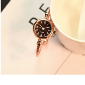 Petite montre vintage en acier inoxydable à quartz pour femme cuivré et noir