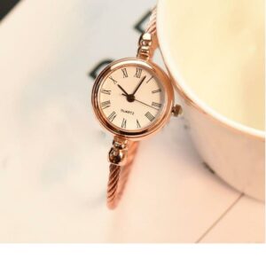 Petite montre vintage en acier inoxydable à quartz pour femme cuivré et blanc