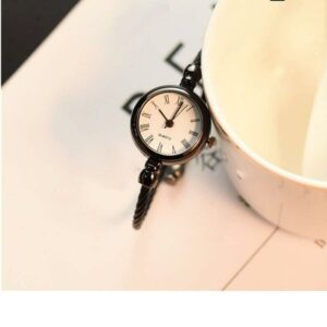 Petite montre vintage en acier inoxydable à quartz pour femme noir et blanc